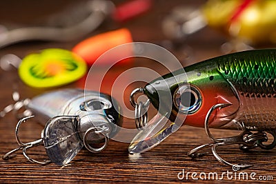 Colorful fishing lures, wobbler, spinner, on wood desk different fishing baits Stock Photo