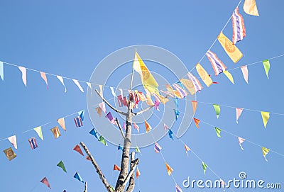 Colorful flags of Buddhism ceremony at Thai temple Stock Photo