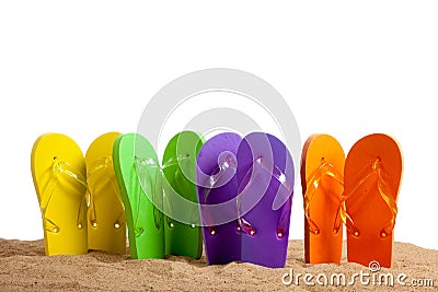 Colorful Flip-Flop Sandles on a Sandy Beach Stock Photo