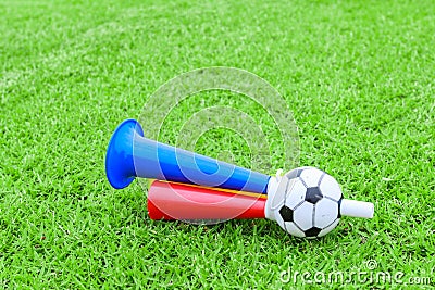 Colorful football hooter on green grass Stock Photo