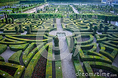 Colorful formal garden at sunset, with a mysterious light Stock Photo