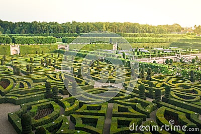Colorful formal garden at sunset, with a mysterious light Stock Photo