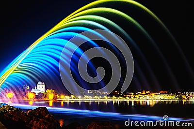 Colorful fountains in city park at night time, long exposure photo Stock Photo