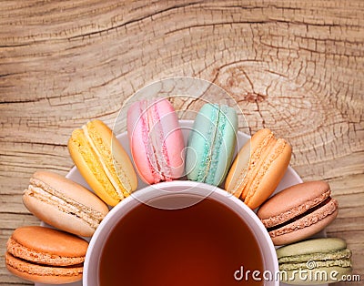 Colorful French Macarons with Cup of Tea Stock Photo