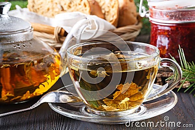 Colorful fresh herbal brewed teas in glass teapots Stock Photo