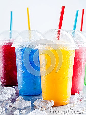 Colorful Frozen Fruit Slush Drinks in Plastic Cups Stock Photo