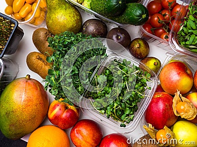 Colorful fruits, vegetables, microgreens sprouts background, rich in antioxidants Stock Photo