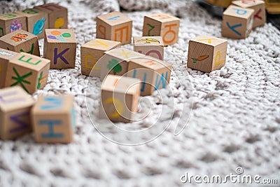 Colorful game cubes on a white carpet Stock Photo