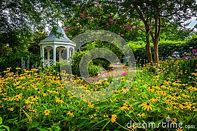 Colorful garden and gazebo in a park in Alexandria, Virginia. Stock Photo