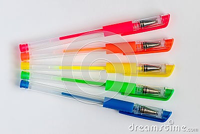Colorful gel neon pens on white background. Stock Photo