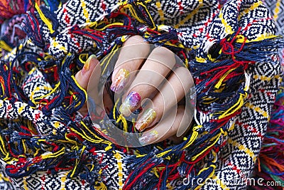 Colorful gel polish painting cute galaxy nail art on beautiful woman fingernail Stock Photo