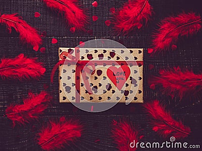 Colorful gift box and paper heart with words of love Stock Photo