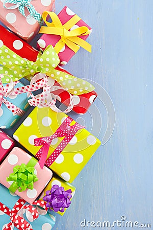 Colorful gift boxes wrapped in dotted paper Stock Photo