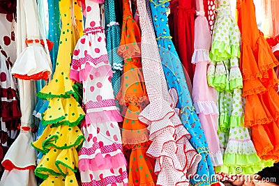 Colorful gipsy dresses in rack hanged in Spain Stock Photo