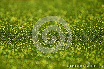 Colorful glowing green glitters texture background Stock Photo