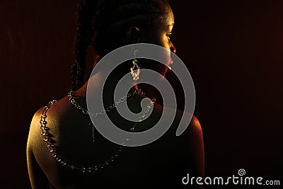 Colorful and creative portrait of african womans back with dark skin Stock Photo