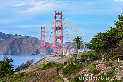 Colorful Golden Gate Bridge and Nature, Trees and Cliffs seen from San Francisco, CA Stock Photo
