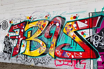 Colorful graffiti art line the street walls Editorial Stock Photo