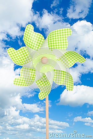 Colorful green pinwheel over blue sky Stock Photo