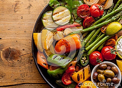 Colorful Grilled Vegetables and Olives on Iron Pan Stock Photo