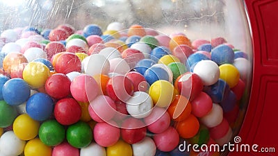 Colorful gumballs in classic vending machine, USA. Multi colored buble gums, coin operated retro dispenser. Chewing gum candies as Stock Photo