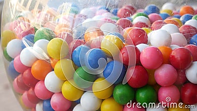 Colorful gumballs in classic vending machine, USA. Multi colored buble gums, coin operated retro dispenser. Chewing gum candies as Stock Photo