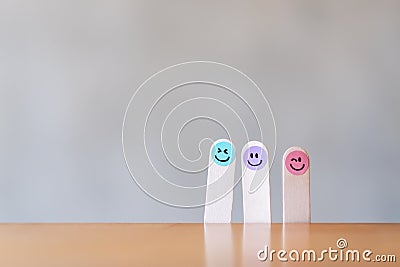 Colorful hand draw happy emotion faces on wooden stick Stock Photo