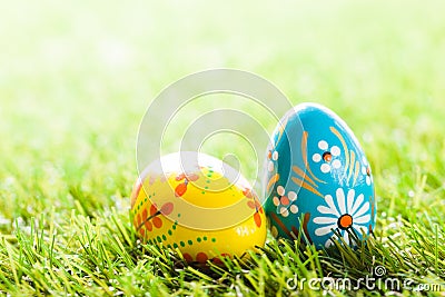 Colorful hand painted Easter eggs in grass. Spring theme Stock Photo
