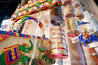 Colorful handbags, bangles, accessories, and decoration items hanging in a shop Editorial Stock Photo