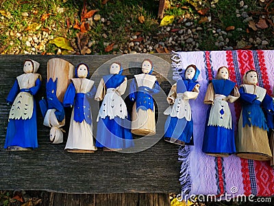 Colorful handmade dolls on a wood Stock Photo