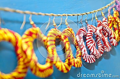 Colorful handmade earrings are being displayed Stock Photo