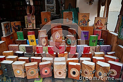 Colorful Handmade leather notebook, Books and agendas outside at a shop front for sale. Souvenir shop with handmade leather bags Editorial Stock Photo
