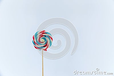 colorful handmade swirl lollipop isolated on white background. multicolored lollipop, Tasty colorful fruit flavored candy. Stock Photo