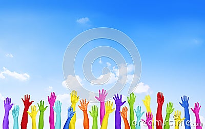 Colorful Hands Raised With Blue Sky Stock Photo