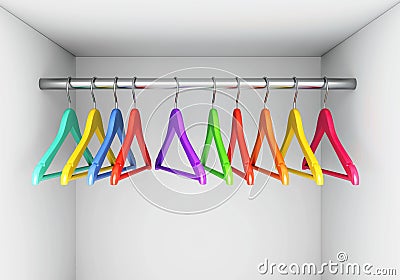 Colorful hangers on cloth rail in wardrobe Stock Photo