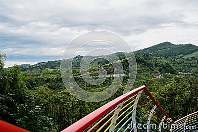 Colorful hillside steel railing in cloudy summer,Danjing Mountain Stock Photo