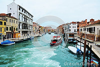 Colorful historical buildings and boats, in Venice, Italy Editorial Stock Photo