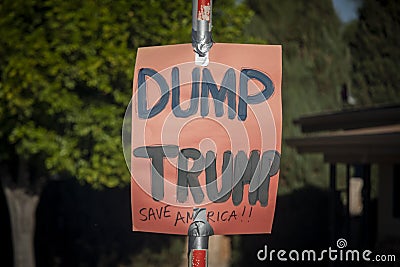 A colorful homemade sign on a pole in opposition to Donald Trump in the 2020 election Editorial Stock Photo