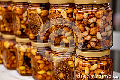 Colorful honey with fruit and nuts in the jar Stock Photo