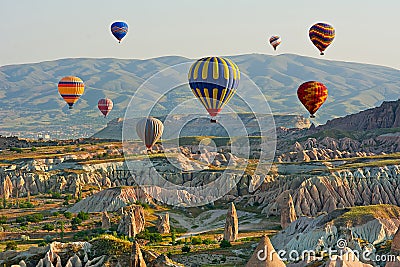 Colorful hot air balloons flying over the valley at Cappadocia Stock Photo