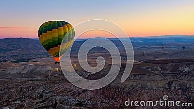 Colorful hot air balloons soaring over the valley at sunrise. Cappadocia,Turkey, autumn Stock Photo