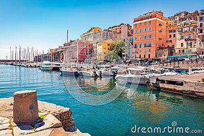 Colorful houses on the shore of Bastia port. Bright morning view of Corsica island, France Editorial Stock Photo
