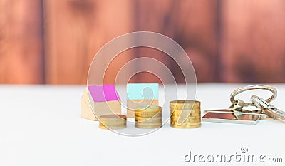 Colorful houses with stack coins Stock Photo