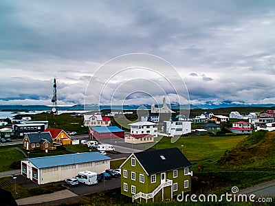 The colorful houses of StykkishÃ³lmur, Iceland with a sky full of coulds wide view Stock Photo