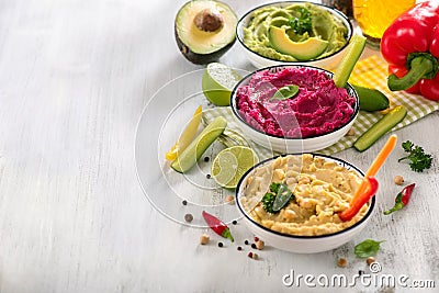 Colorful hummus, vegan snack, beetroot and avocado hummus, vegetarian eating, copy space background Stock Photo
