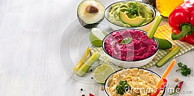 Colorful hummus, vegan snack, beetroot and avocado hummus, vegetarian eating, copy space background Stock Photo