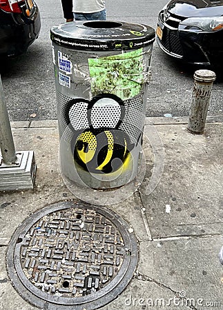 Detail of a garbage bin and a sewer in the New York City neighborhood. Editorial Stock Photo