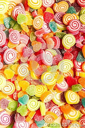 Colorful jellies and candies sweets heart-shaped background Stock Photo