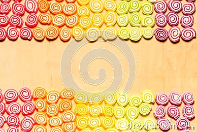 Colorful jellies and candies sweets on wood background Stock Photo