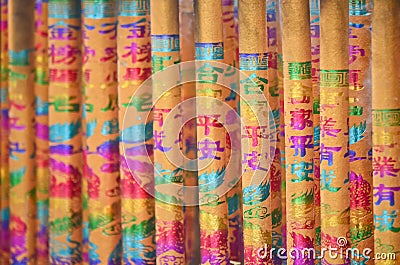 Colorful joss-stick with Chinese auspicious calligraphy & graphic Stock Photo